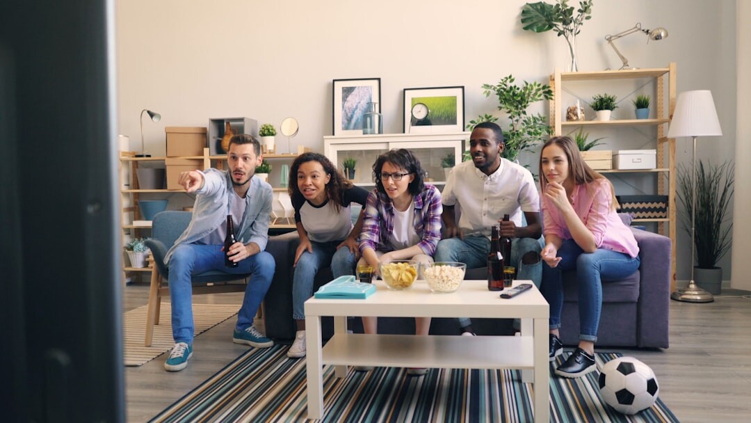 group watching viral video