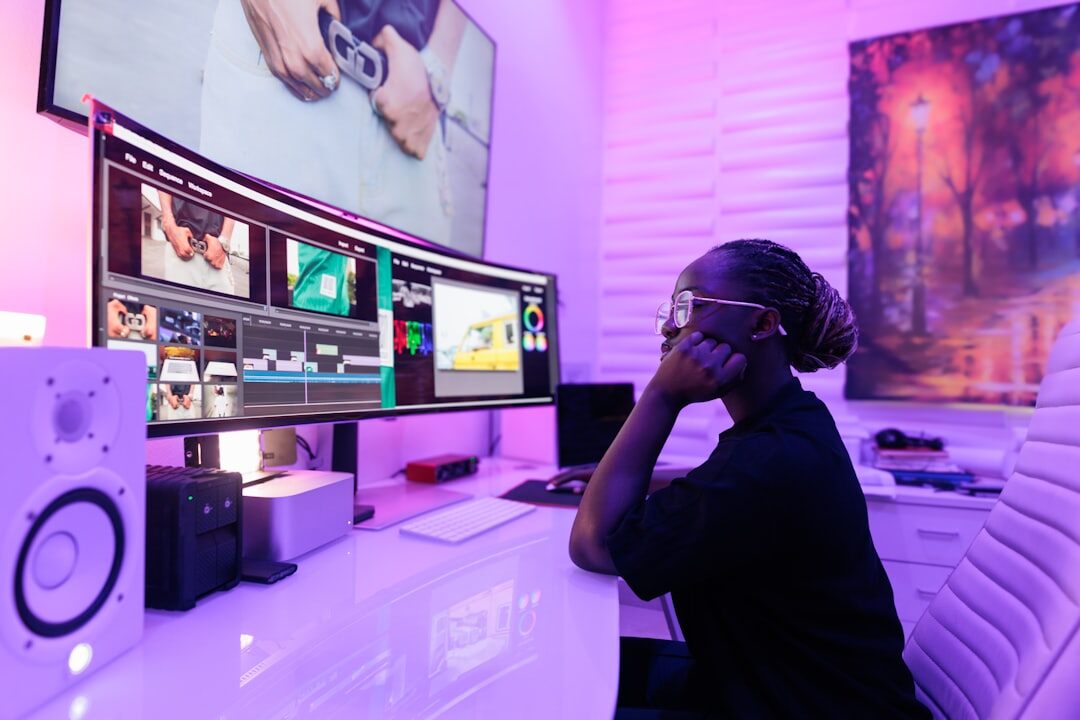 person editing video on computer